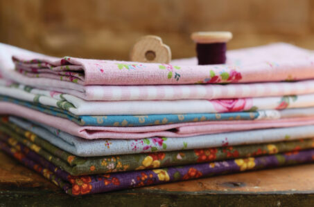 Pile of floral pattern textile in shabby style